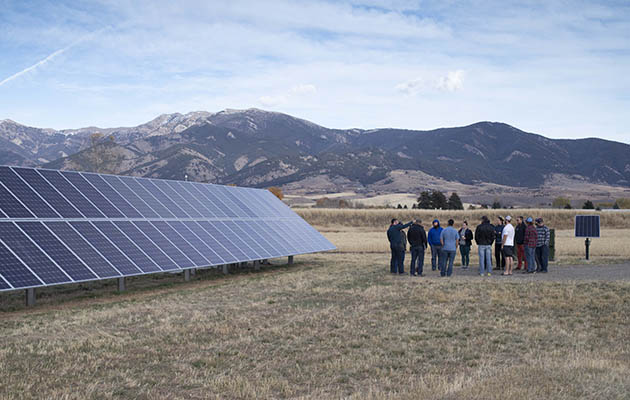 Students look at solar panels in Bozeman Montana